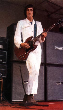 Ca. 1969, onstage with the original-model Univox Super-Fuzz. Amps are Hiwatt-badged customized Sound City L100 (top), pre-nameplate Hiwatt CP103s. Guitar is Gibson SG Special.
