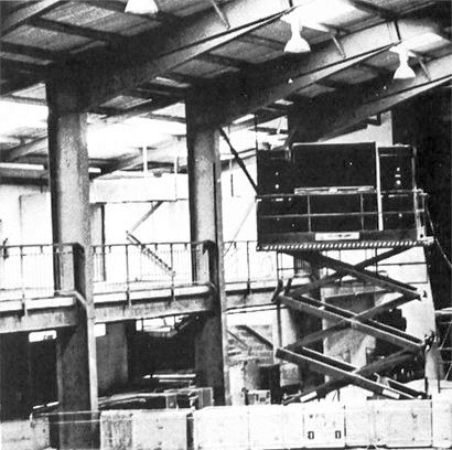 The stage-right side of the P.A., “flown” on a scissor lift.