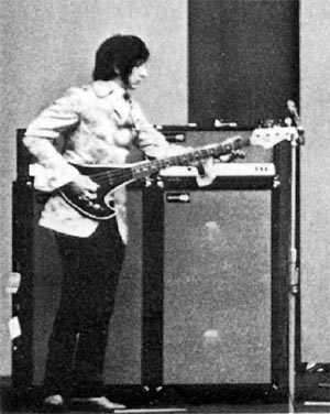 Ca. 1967, in the U.S., with two Sunn 100S amplifiers and Sunn 200S 2×15 cabinets. Bass is custom “Axe” bass.