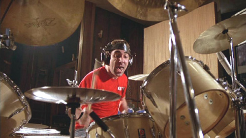 May 1978, in the studio, with natural-finish single-bass drum kit, with extra hi-hat and Zildjian cymbal visible in foreground.