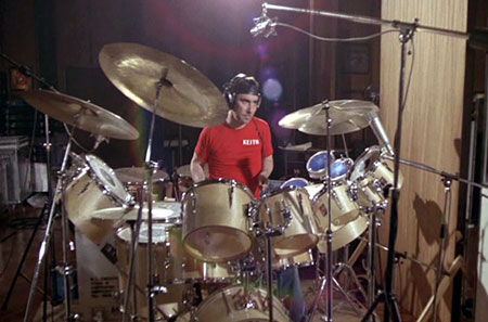 May 1978, in the studio, with natural-finish single-bass drum kit.