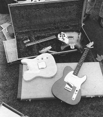 Ca. 1966, a collection of broken guitars, including two Telecasters and a Rickenbacker Rose Morris 1997.