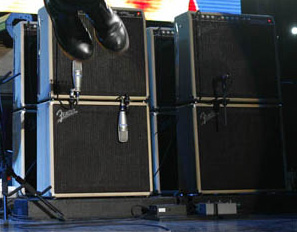 Ca. 2006, detail of Fender Vibro-King primary/backup setup (microphones: left: Shure KSM44; right: Shure SM-57) Cornish splitter boxes visible at bottom.