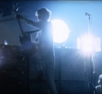 Still from third Isle of Wight Festival, 29–30 August 1970, with large film lamp (on) behind Pete’s amps.