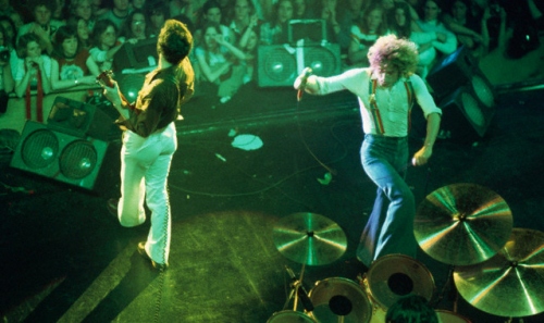 1976, from atop the stage, with floor wedge monitors visible across front of stage.