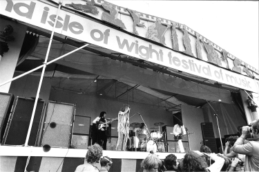 30 August 1969, the 2nd Annual Isle of Wight festival, which featured The Who’s 2,500-watt WEM PA system. Three of The Who’s Marshall 8×10 cabs visible at stage-right, and two stacked WEM cabinets as foldback seen at far right. © repfoto.com.