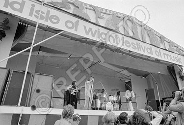 August 1969, the 2nd Annual Isle of Wight festival, which featured The Who’s 2,500-watt WEM PA system. Three of The Who’s Marshall 8x10 cabs visible at stage-right, and two stacked WEM cabinets as foldback seen at far right. © repfoto.com.
