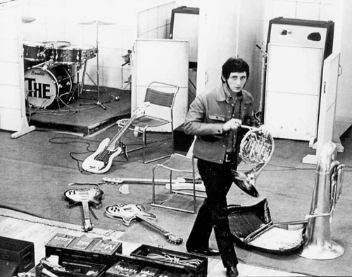 3 Oct. 1966, at CBS studios, John holding French horn. Leaning against the chair, the 1962 Fender Precision Bass, left, and on the floor, the 1966 “Slab” Fender Precision Bass.