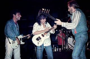 Ca. June 1986, at NAMM in Chicago, with Eddie Van Halen, promoting the new Buzzard bass.