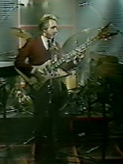 1983 Gastank television performance with the Alembic with “V”-shaped headstock.