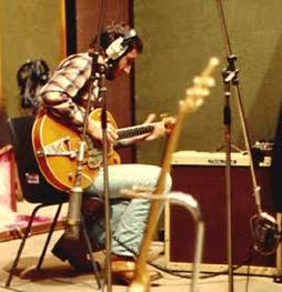 Ca. 1976/77, at Olympic Studios, recording Rough Mix, with Gretsch Chet Atkins, 1970s Peavey Vintage 4×10 amplifier, coil cable and Electro-Harmonix Big Muff Pi fuzz pedal.
