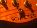 Click to view detail – Gold Schecter – headstock