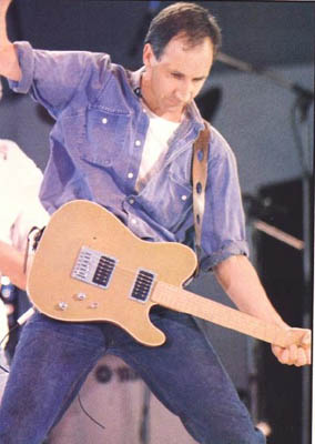 Live Aid concert, 1985, with gold Schecter.